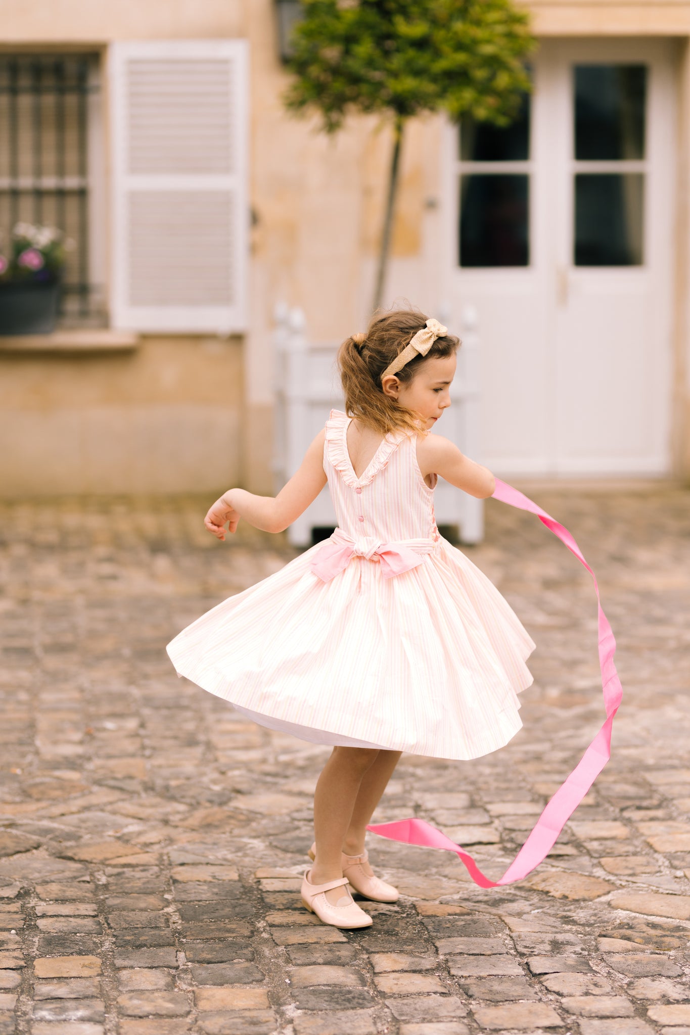 Capucine Pink Yellow Stripe Sleeveless Smocked Dress